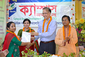 President of REHAB, Mukarram Hussain Khan, gives Certificates to the Trainees of Free Computer Training (Batch 128) as Chief Guest; Dr. M Helal is presiding over. (2014)